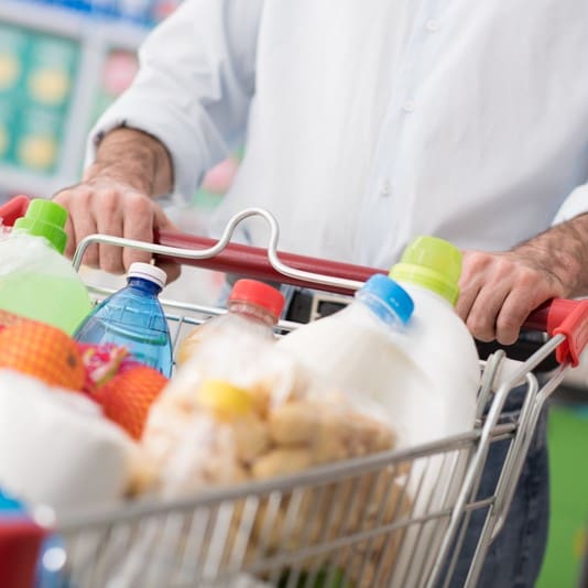 A person checking their grocery list before shopping